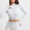 Rygglös långärmad crop top med hög hals i gråmelerad Rygglös långärmad crop top med hög hals i gråmelerad