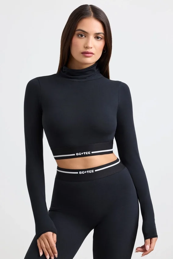 Rygglös långärmad crop top med turtleneck i svart Rygglös långärmad crop top med turtleneck i svart