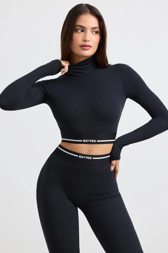 Rygglös långärmad crop top med turtleneck i svart Rygglös långärmad crop top med turtleneck i svart