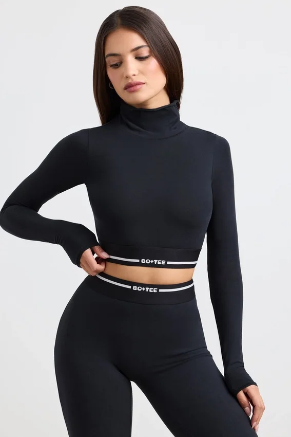 Rygglös långärmad crop top med turtleneck i svart Rygglös långärmad crop top med turtleneck i svart