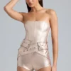 Sasha metallic-denim-korsettplaysuit med bälte i champagne Sasha metallic-denim-korsettplaysuit med bälte i champagne