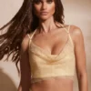 Selena korsett med dekorerad cowl-hals i guld Selena korsett med dekorerad cowl-hals i guld