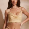 Selena korsett med dekorerad cowl-hals i guld Selena korsett med dekorerad cowl-hals i guld