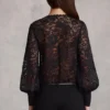 Serenya genomskinlig spets-playsuit med djup urringning och lös passform i svart Serenya genomskinlig spets-playsuit med djup urringning och lös passform i svart