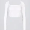 Sömlös, mjuk ribbad crop top med utskärningar i vitt Sömlös, mjuk ribbad crop top med utskärningar i vitt