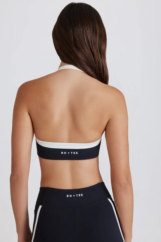 Soft Active sport-BH med vridet framsida och halterneck i svart Soft Active sport-BH med vridet framsida och halterneck i svart