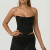 Sterling Embellished Draped Corset Top i svart Sterling Embellished Draped Corset Top i svart