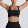 Super Sculpt sömlös sport-BH med T-rygg i svart Super Sculpt sömlös sport-BH med T-rygg i svart
