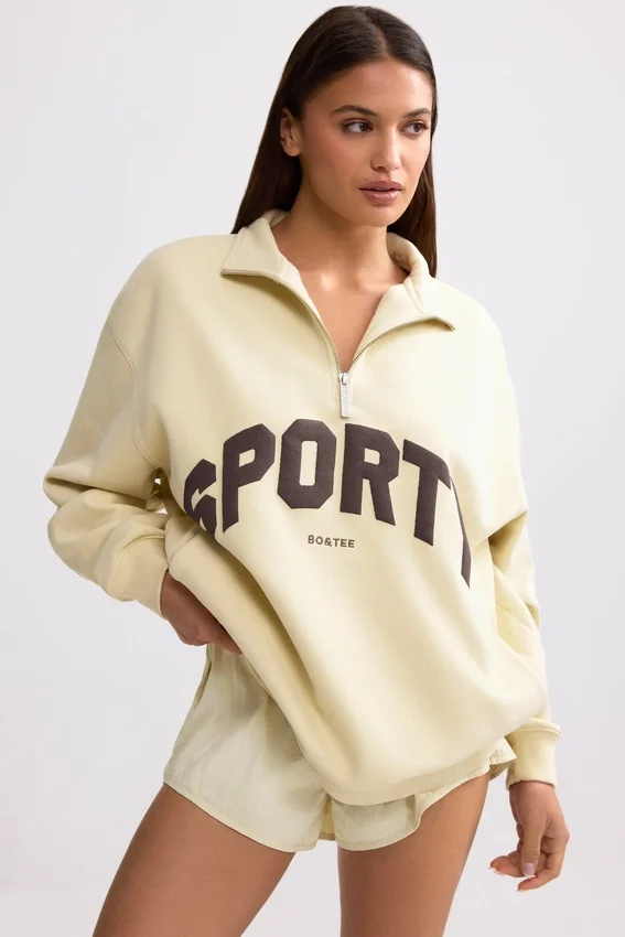 Sweatshirt med kvartslås i benvit Sweatshirt med kvartslås i benvit