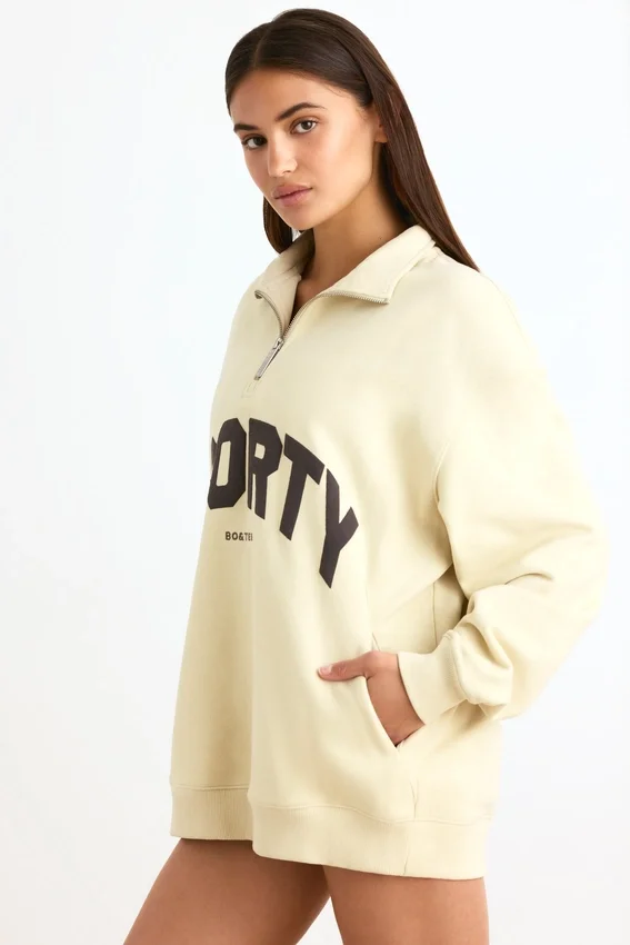 Sweatshirt med kvartslås i benvit Sweatshirt med kvartslås i benvit