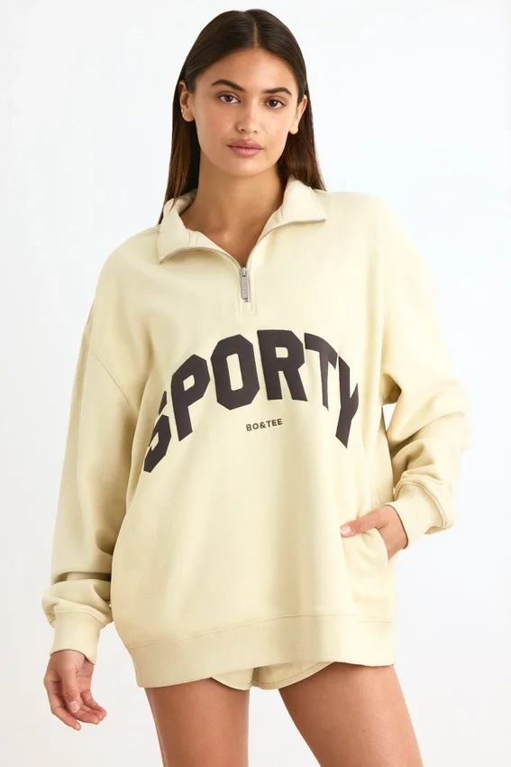 Sweatshirt med kvartslås i benvit Sweatshirt med kvartslås i benvit