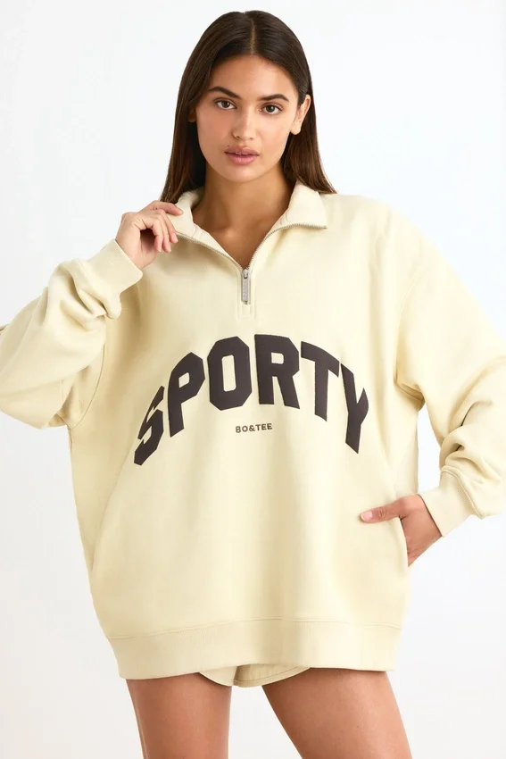 Sweatshirt med kvartslås i benvit Sweatshirt med kvartslås i benvit