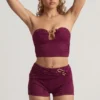 Tarni bandeau-crop-top med metalldetaljer i bärlila Tarni bandeau-crop-top med metalldetaljer i bärlila