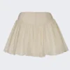 Thia minikjol med rosettdetalj i broderie anglaise i elfenben Thia minikjol med rosettdetalj i broderie anglaise i elfenben