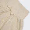 Thia minikjol med rosettdetalj i broderie anglaise i elfenben Thia minikjol med rosettdetalj i broderie anglaise i elfenben