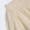 Thia minikjol med rosettdetalj i broderie anglaise i elfenben Thia minikjol med rosettdetalj i broderie anglaise i elfenben