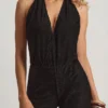 Tulay Devoré jumpsuit med halterneck och öppen rygg i svart Tulay Devoré jumpsuit med halterneck och öppen rygg i svart