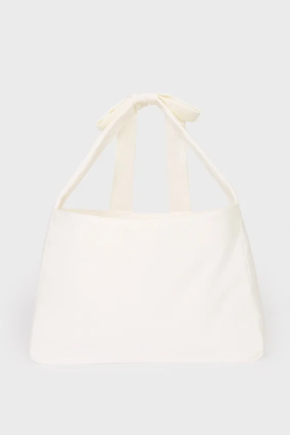 Tygväska i corduroy med rosett i färgen Ivory Tygväska i corduroy med rosett i färgen Ivory