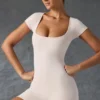 Unitard med rund halsringning i tvättad krämfärg Unitard med rund halsringning i tvättad krämfärg