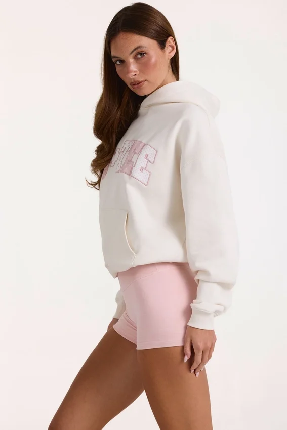 Överdimensionerad hoodie med applikation i elfenben Överdimensionerad hoodie med applikation i elfenben