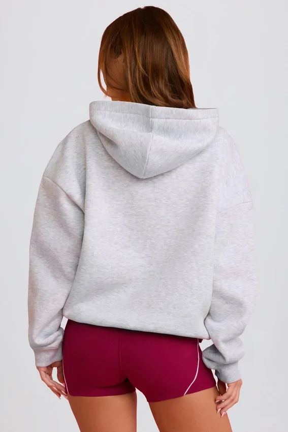 Överdimensionerad hoodie med applikation i grått Överdimensionerad hoodie med applikation i grått