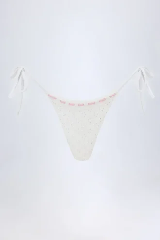 Vernazza Broderie Anglaise stringbikinibyxor med knytband i sidorna i vitt Vernazza Broderie Anglaise stringbikinibyxor med knytband i sidorna i vitt