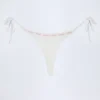 Vernazza Broderie Anglaise stringbikinibyxor med knytband i sidorna i vitt Vernazza Broderie Anglaise stringbikinibyxor med knytband i sidorna i vitt