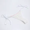 Vernazza Broderie Anglaise stringbikinibyxor med knytband i sidorna i vitt Vernazza Broderie Anglaise stringbikinibyxor med knytband i sidorna i vitt