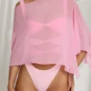 Zarayah genomskinlig poncho i Candyfloss Pink Zarayah genomskinlig poncho i Candyfloss Pink