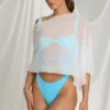 Zarayah genomskinlig poncho i vitt Zarayah genomskinlig poncho i vitt