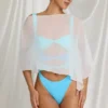 Zarayah genomskinlig poncho i vitt Zarayah genomskinlig poncho i vitt