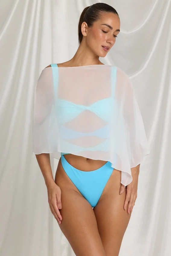 Zarayah genomskinlig poncho i vitt Zarayah genomskinlig poncho i vitt