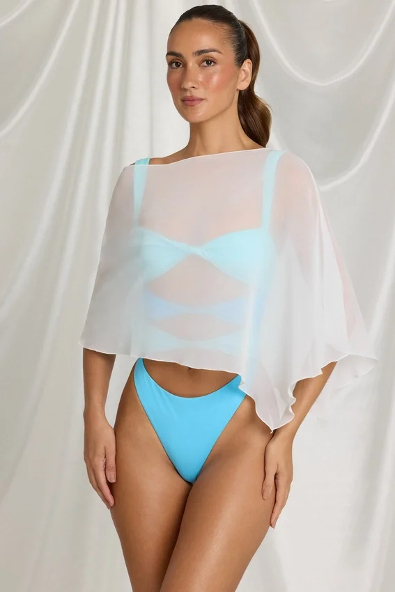 Zarayah genomskinlig poncho i vitt Zarayah genomskinlig poncho i vitt